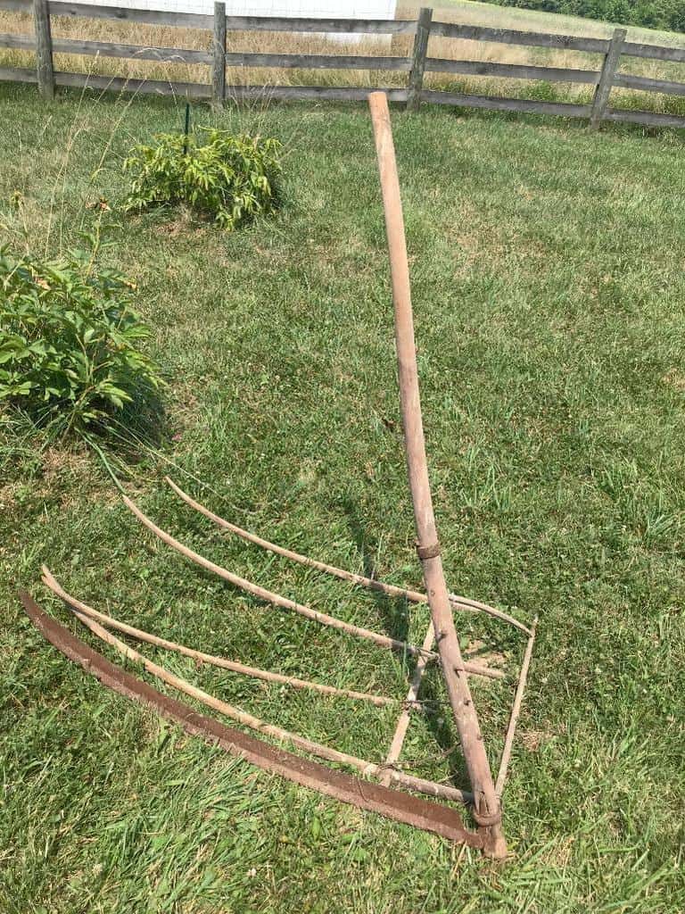 Early hand-held hay rakes