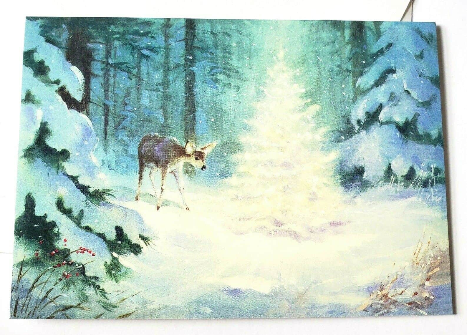 Deer in Snowy Forest Standing By A Glowing Lighted Tree