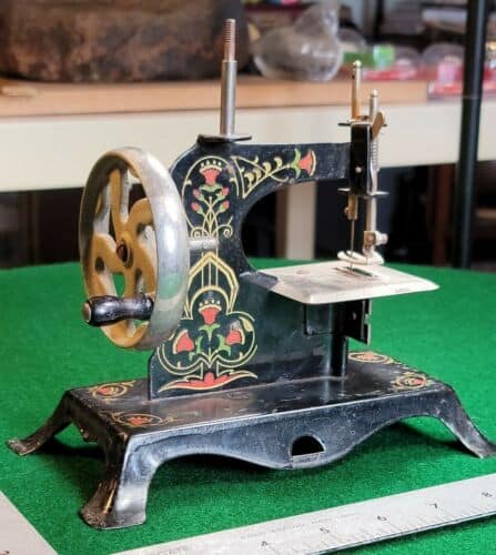 German hand-painted toy sewing machine