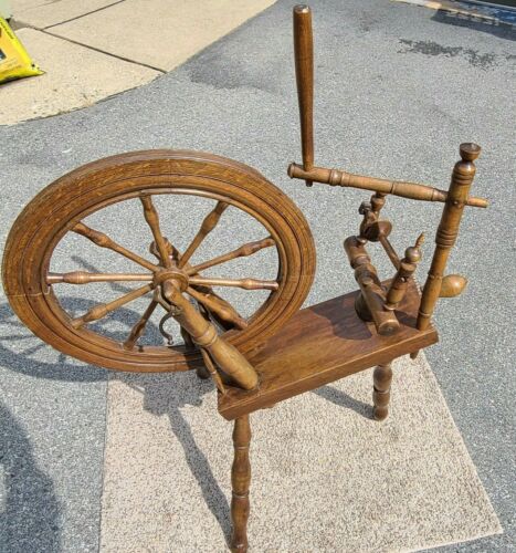 Wooden spinning wheel with a green mark