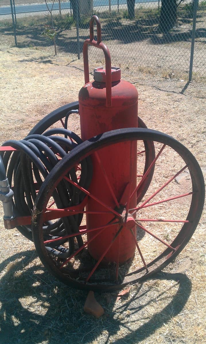 Antique fire extinguisher on wheels
