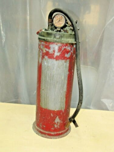 Empty steal red fire extinguisher