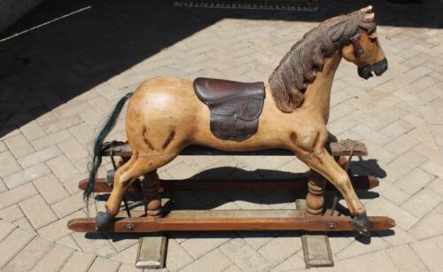 English wooden rocking horse toy with leather saddle