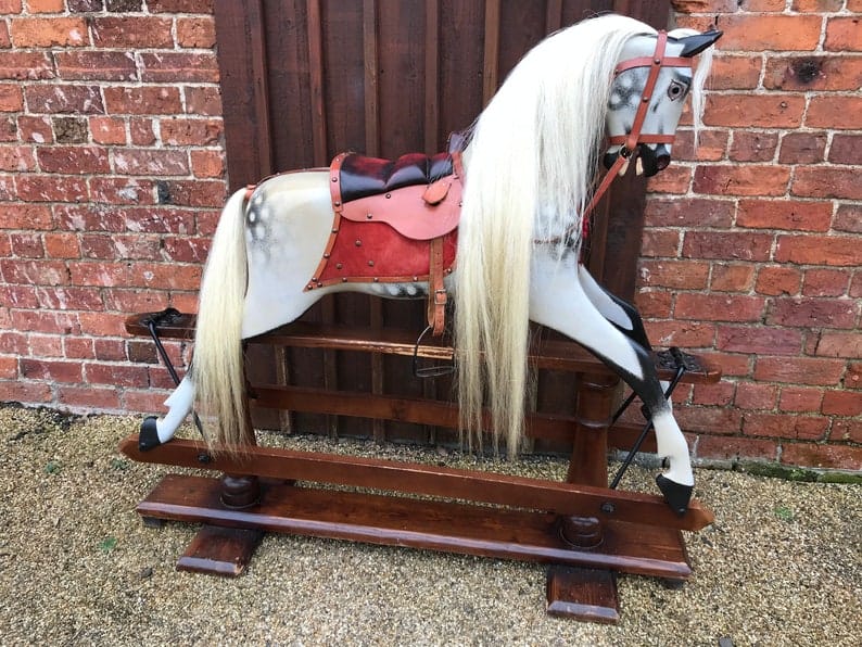 Large antique rocking horse by English maker F.H. Ayres